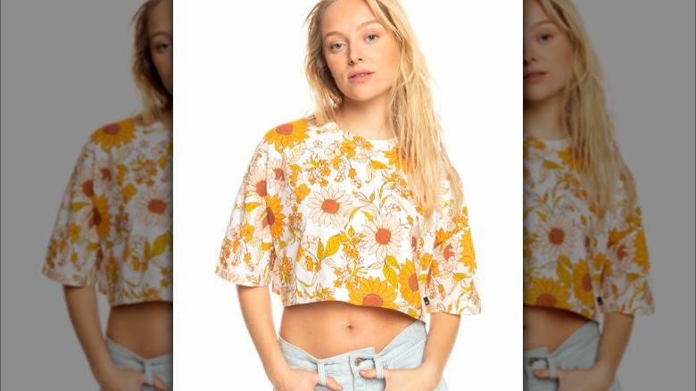 Model wearing yellow sunflower cropped t-shirt