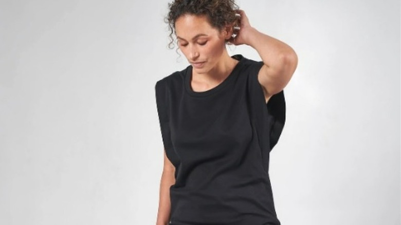 Model wearing black wing sleeve t-shirt