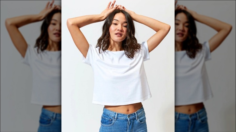 Model wearing white cropped t-shirt