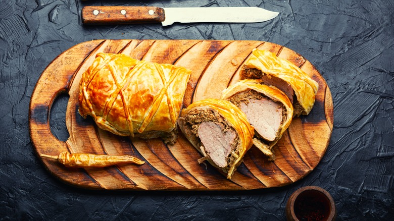 Beef wellington on cutting board