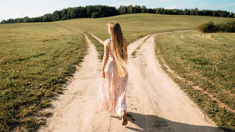 Woman at crossroads