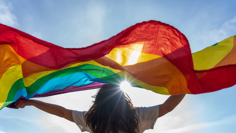 Woman holding pride flag