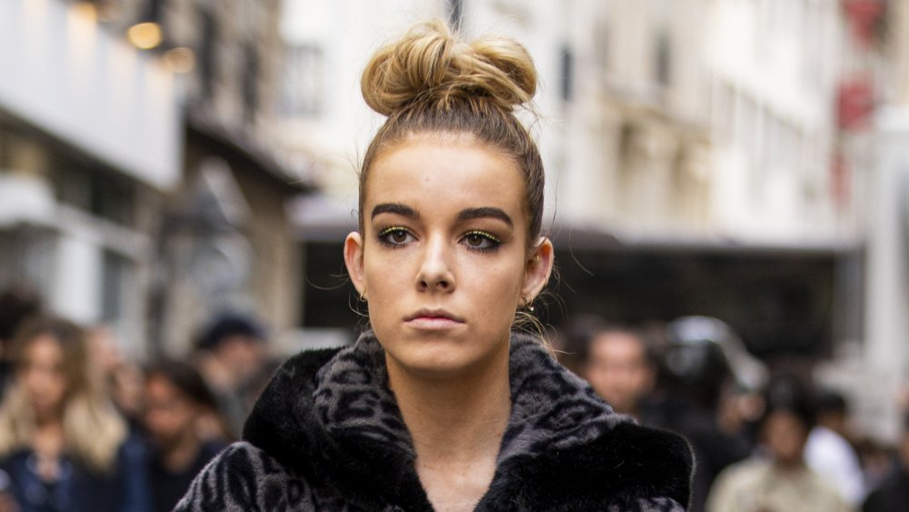 woman with hair in messy bun