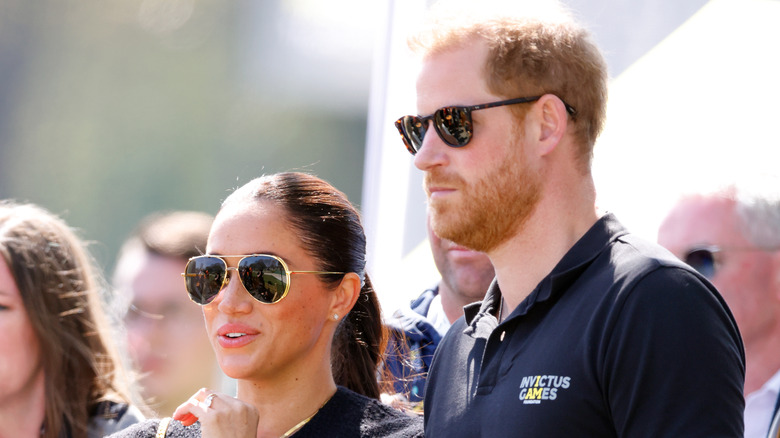 Prince harry and meghan markle wearing sunglasses