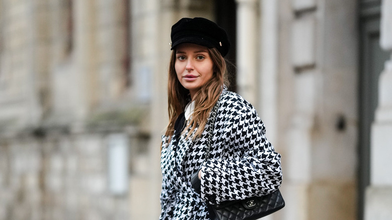 Woman in a checked coat, hat