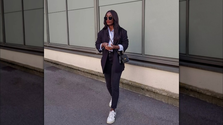 influencer wearing Vejas sneakers with blazer