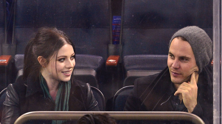 Taylor Kitsch and Michelle Trachtenberg at a game