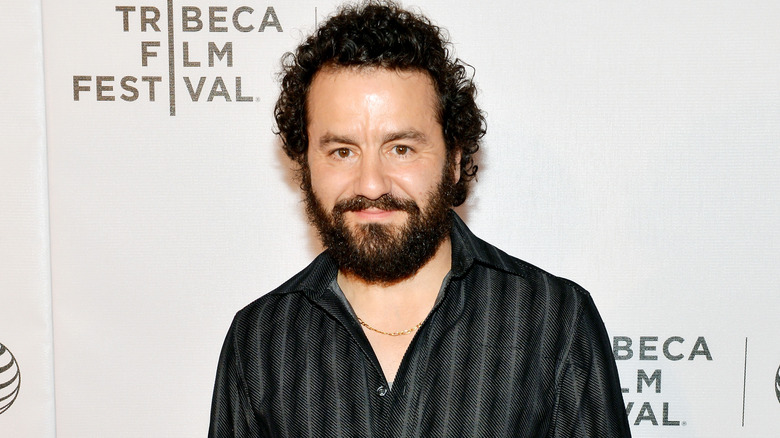 Max Casella posing at premiere