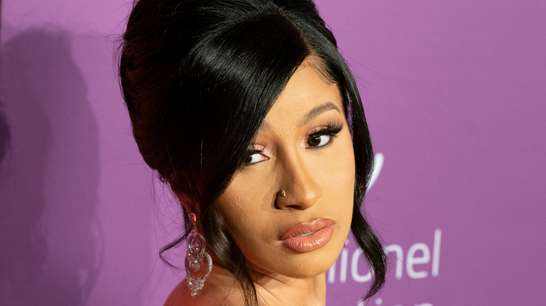 Cardi B poses with her mouth slightly open.