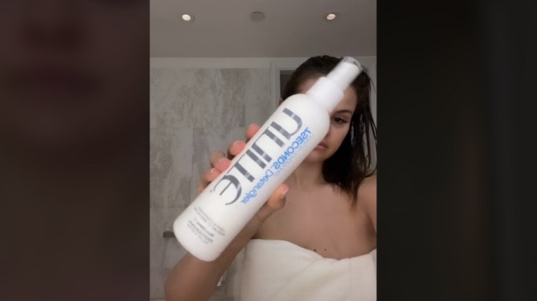 Selena Gomez holding Unite 7Seconds Detangler 