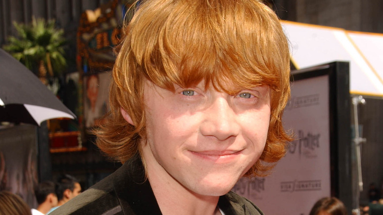 Rupert Grint smirks at the camera