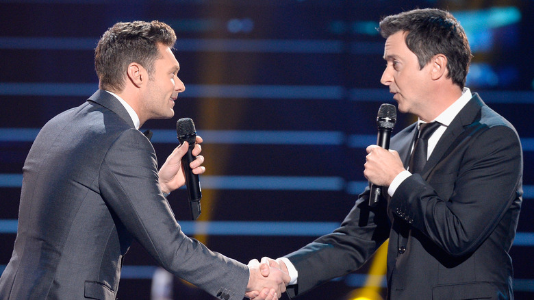 Brian Dunkleman and Ryan Seacrest shaking hands