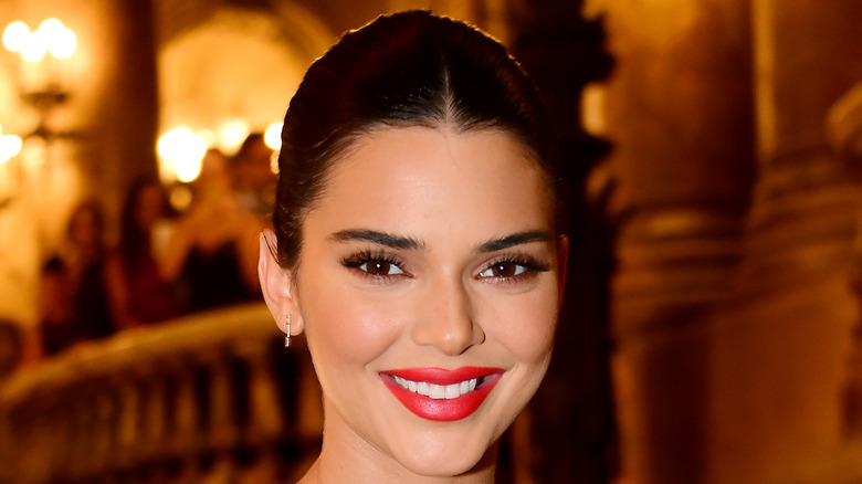 Kendall Jenner smiles at an event