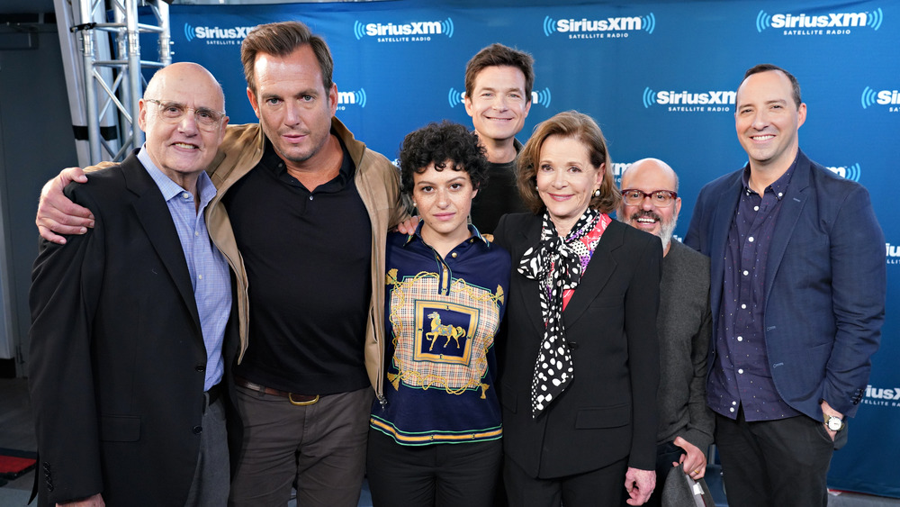 Cast of Arrested Development posing at event