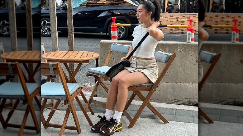 Woman wearing baby tee and skirt