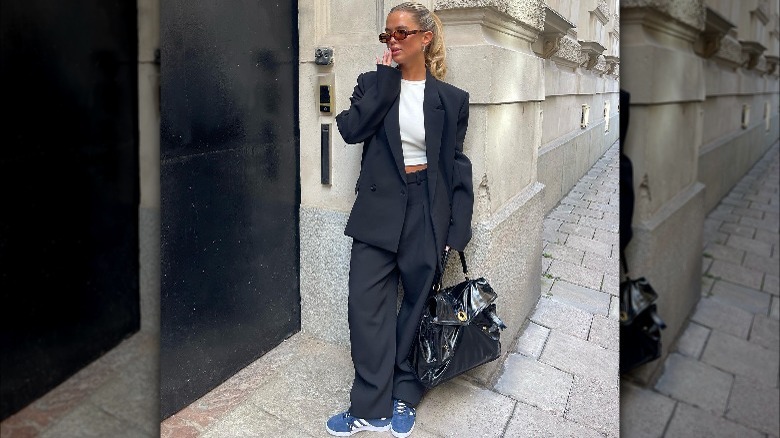 Woman wearing baby tee and suit