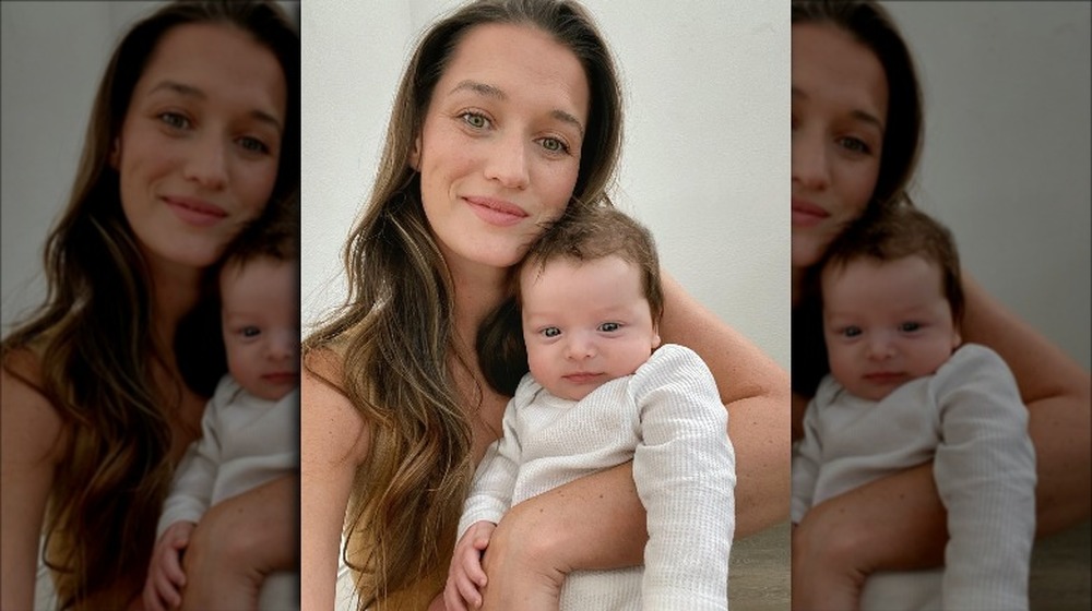 Jade Roper holds her baby Reed