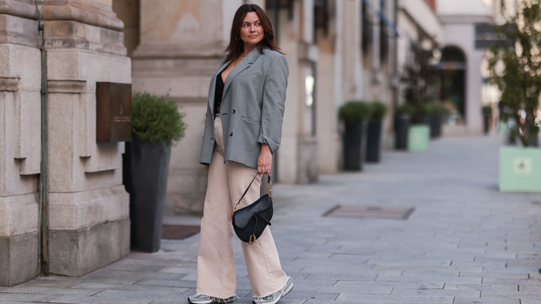 woman wearing saddle bag