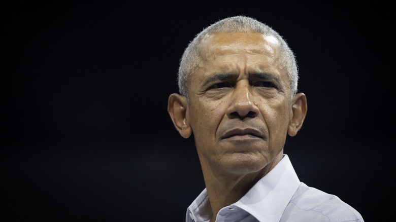 Barack Obama frowning and looking serious