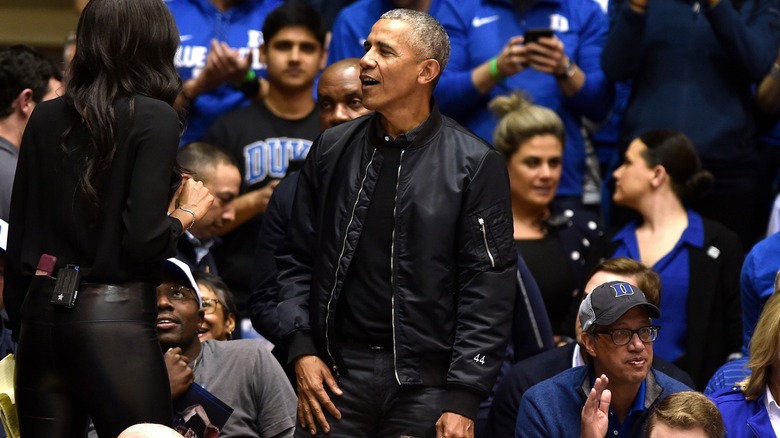 Barack Obama at a basketball game in a custom jacket