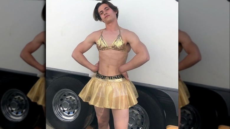 Tanner in gold bikini and skirt