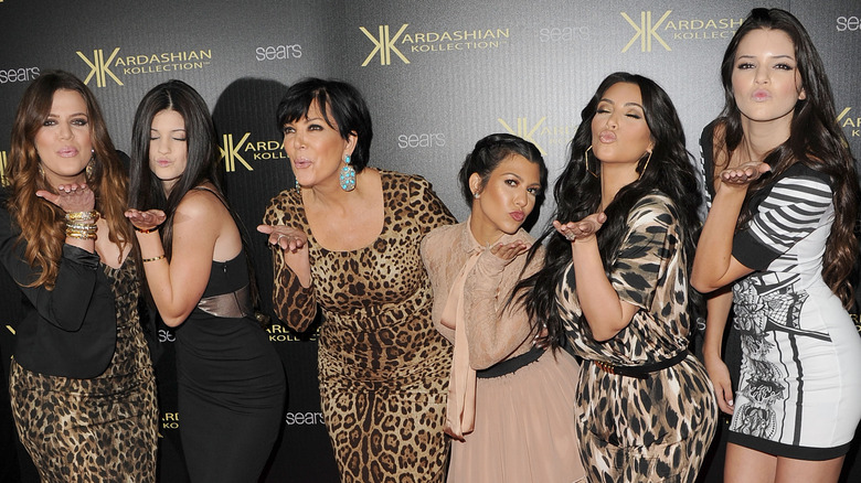 The Kardashian sisters pose with Kris Jenner