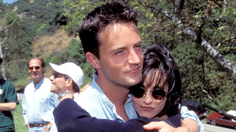 Matthew Perry and Courteney Cox hug