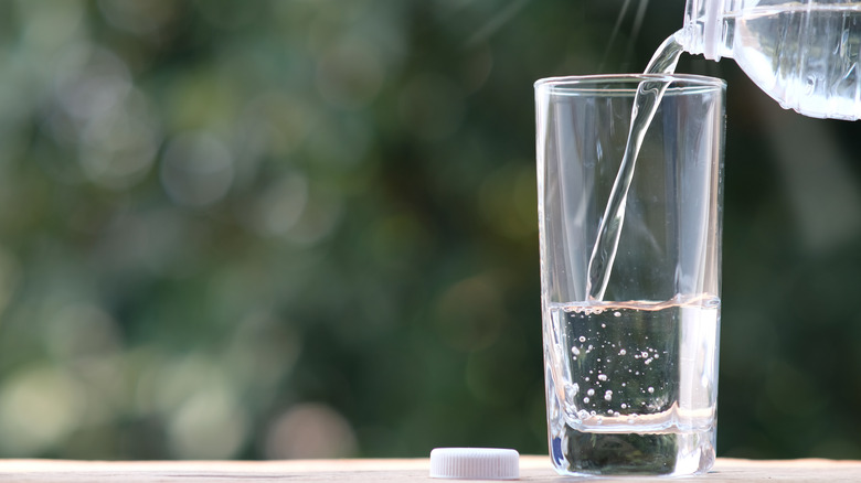 Pouring water into a glass