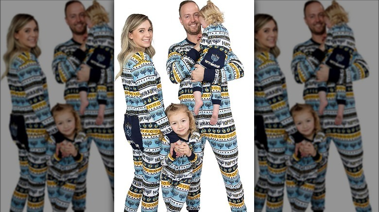 Family wearing blue and white Hanukkah-themed pajamas