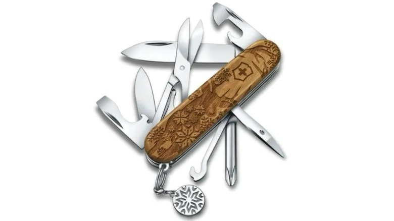 Carved wood multitool with silver tools