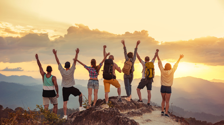 A group of friends at the top of a mountain 