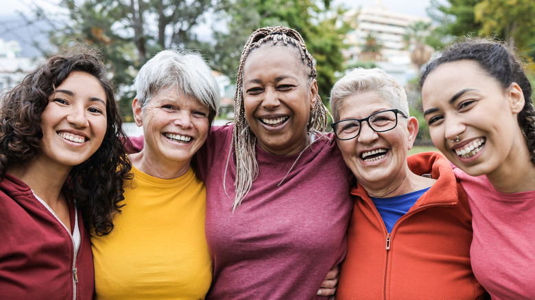 Five women embracing like friends 