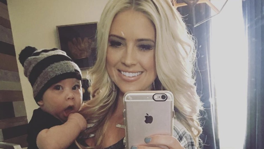 Christina Anstead holding Brayden El Moussa 