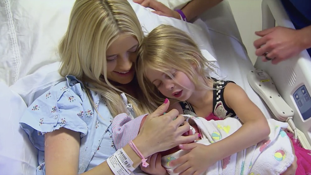 Christina Anstead and her daughter holding Brayden El Moussa 