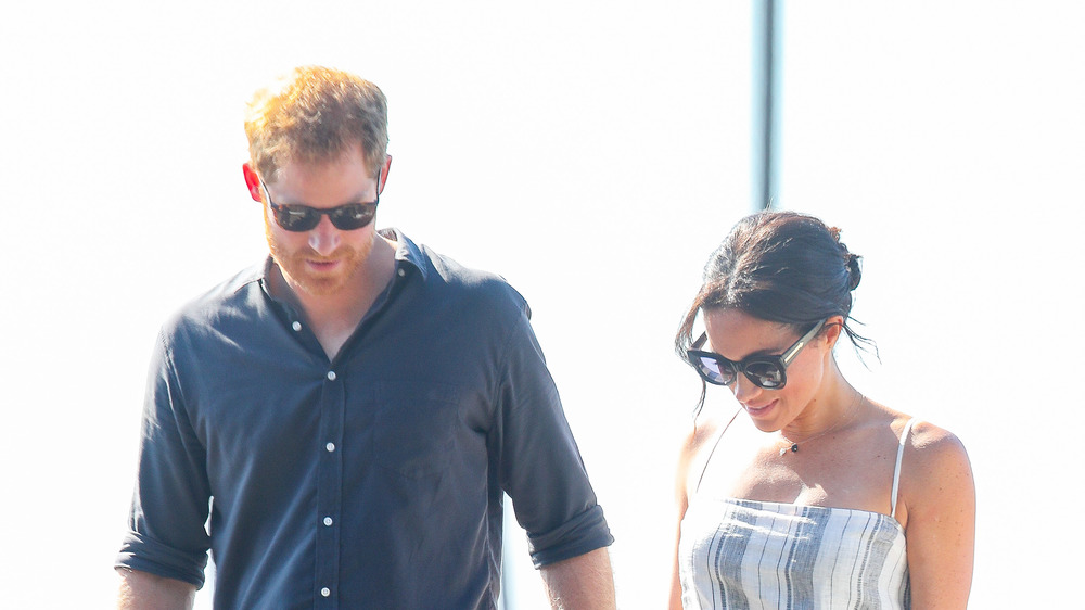 Prince Harry and Meghan Markle walking