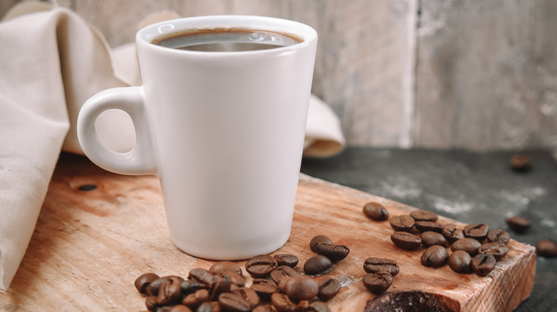 Cup of coffee, coffee beans