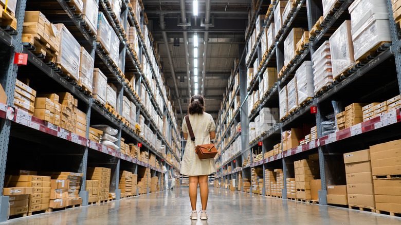 Woman standing in the middle of an Ikea warehouse