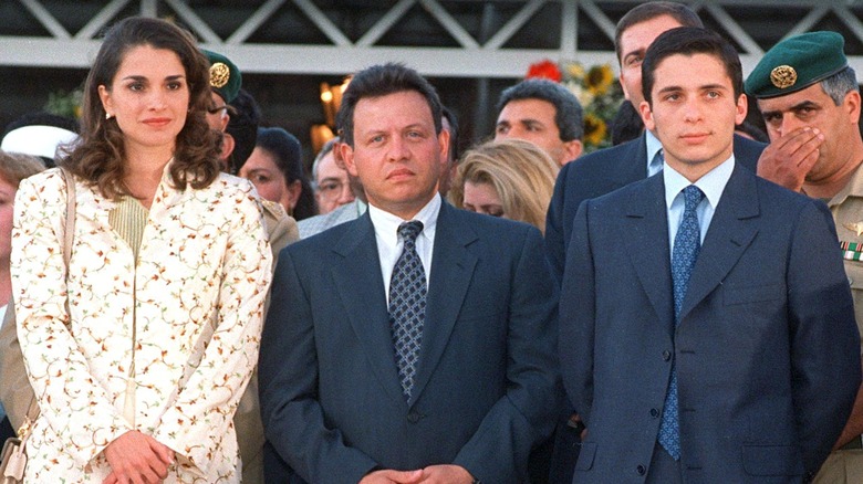 Queen Rania, King Abdullah, and Prince Hamzah posing together