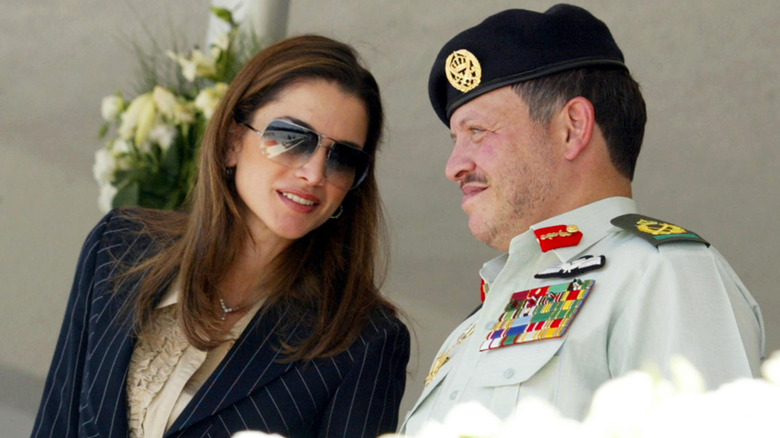 Queen Rania and King Abdullah looking at each other