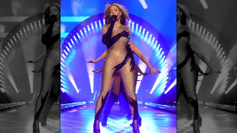 Beyoncé wearing bodysuit with hand silhouettes 