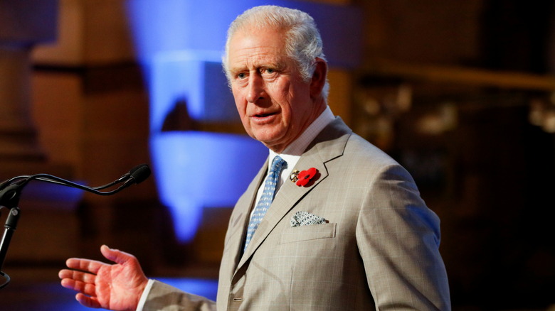 Prince Charles speaking into a mic