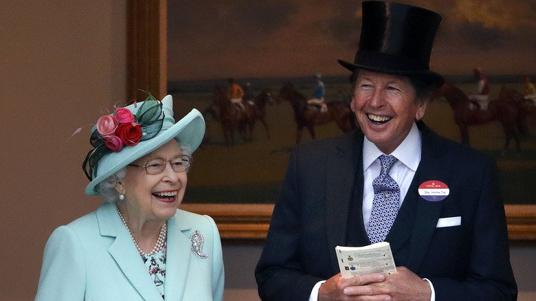 The Queen laughing with her racing manager