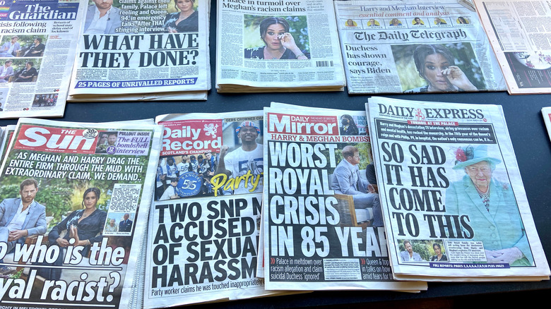 Newspapers showing Prince Harry and Meghan Markle