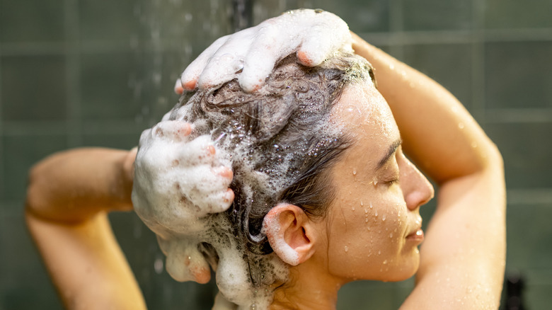 Woman shampooing in the shower