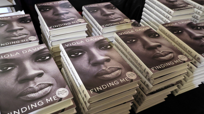 stacks of the hardcover version of viola davis's memoir, "finding me"