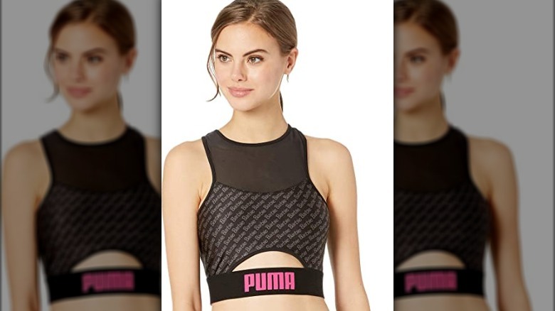 Woman wearing Puma Barbie sports bra