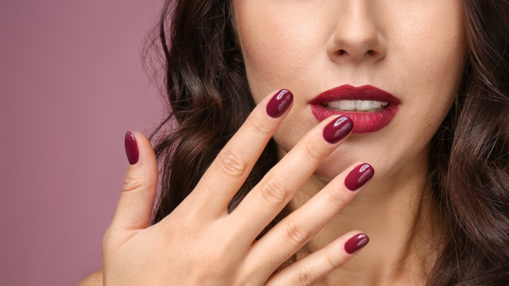 a woman with gel nails