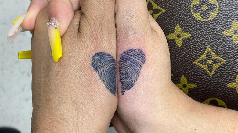 matching fingerprint heart tattoos