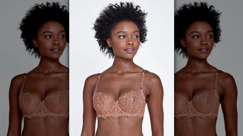 Model wearing beige lace balconette bra