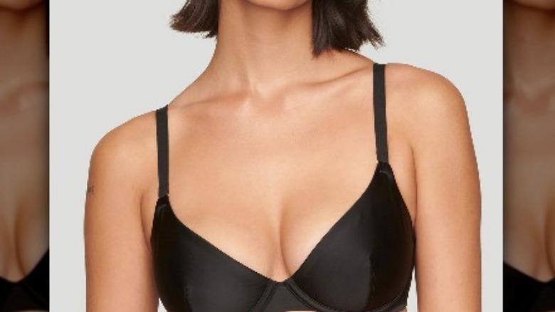 Model wearing black plunge bra from Cuup